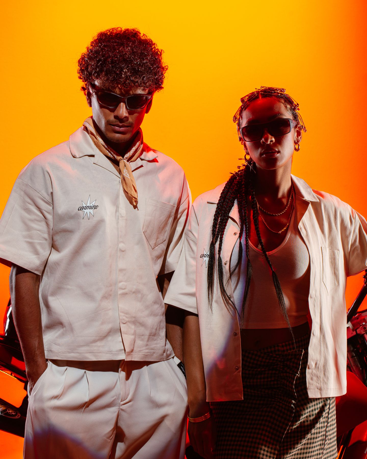 Carmine campaign, two models on amber